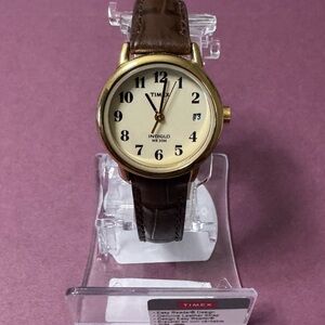 Timex intaglio 
Gold Case with Brown Strap Watch
Brand new and working